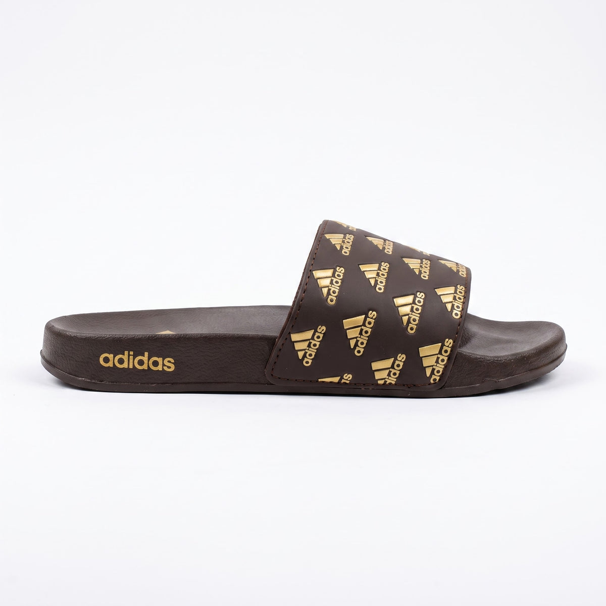 Side profile of brown Adidas Adilette slides with gold heel logo