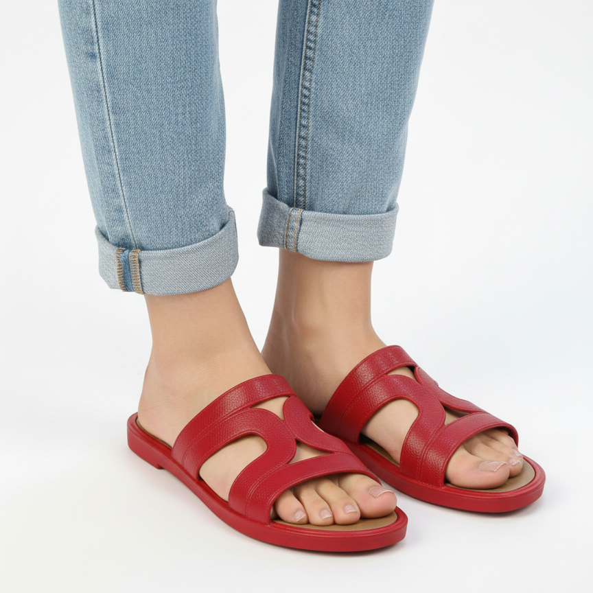 Textured red hollow cutout strap pattern close up
